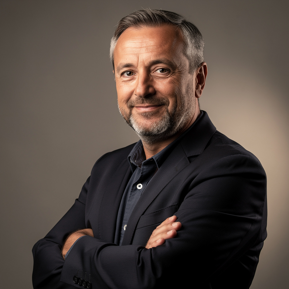 Studio portrait of a Croatian male novelist in his fifties wearing a dark blazer